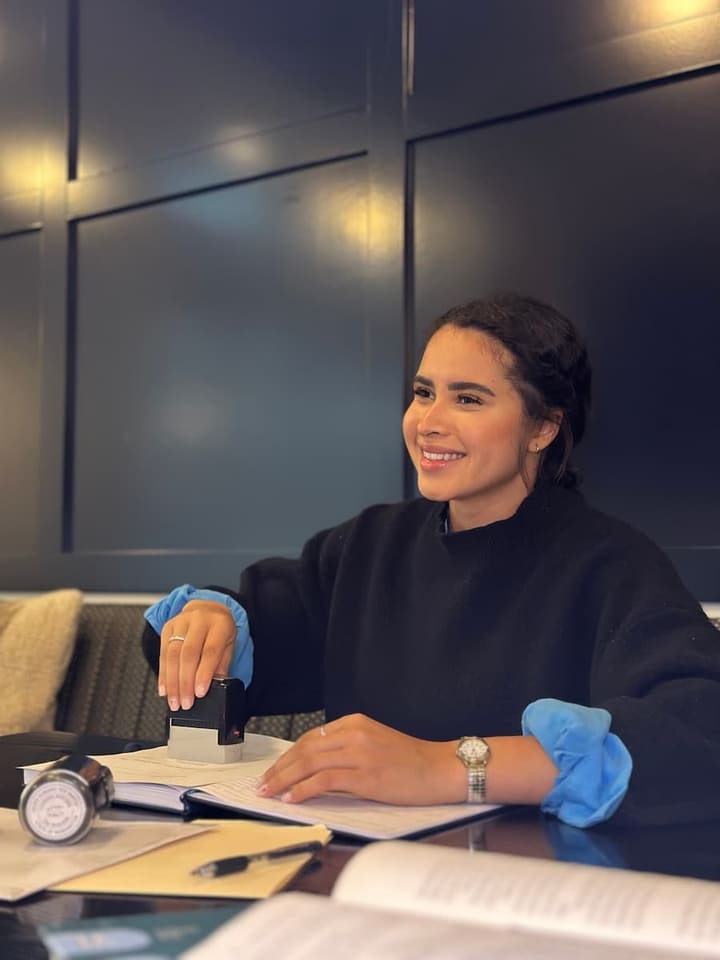 Ingrid Santos, Austin mobile notary, stamping a notarized document